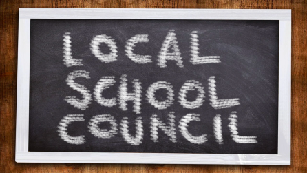 A chalkboard reading: "Local School Council"